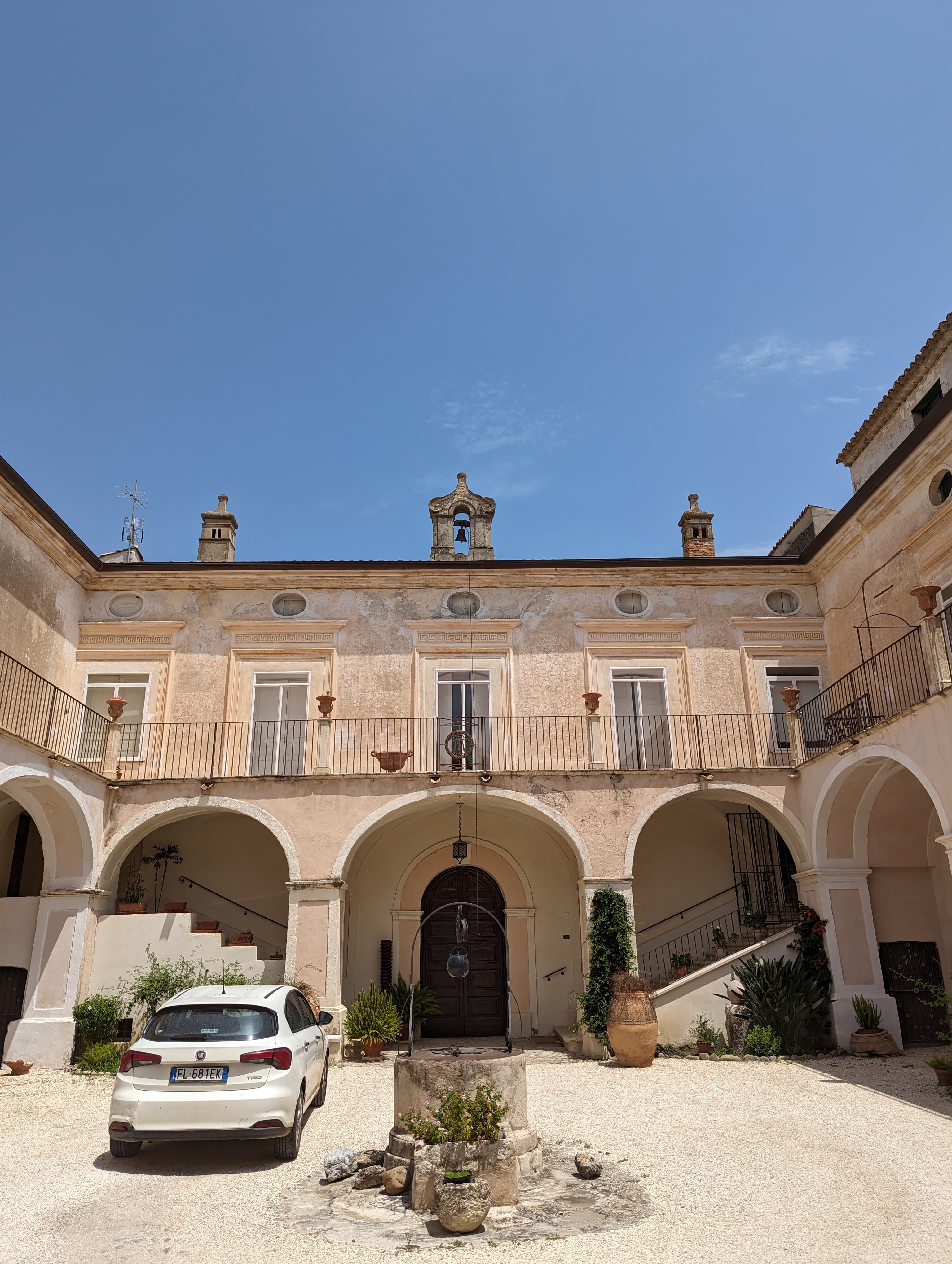 Historic courtyard with arches and fountain